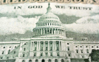 Closeup of the US Capitol on an American fifty dollar bill.