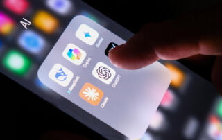 Person navigating AI apps on their phone - emerging risks: can AI lead to false claims?